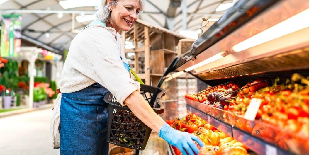 Elderly Woman Shopping for Fresh Produce at Assisted Living Facility