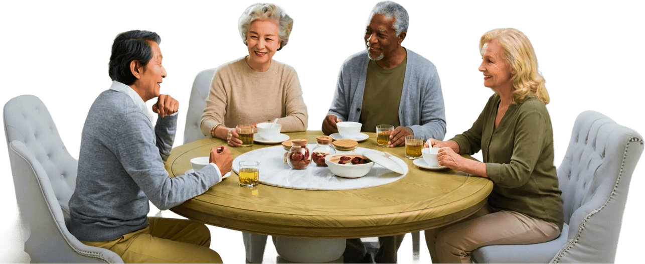 Four Elderly Friends Chatting Over Tea at a Table in Independent Living Four Elderly Friends Chatting Over Tea at a Table in Independent Living