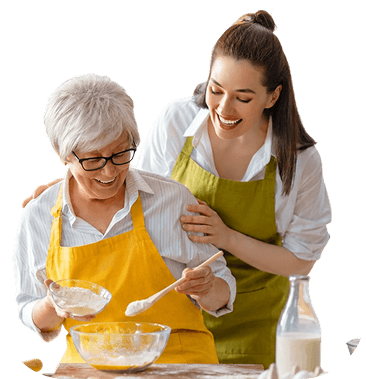 Elderly Woman Baking With Her Daughter in the Kitchen at an Independent Living Community Elderly Woman Baking With Her Daughter in the Kitchen at an Independent Living Community