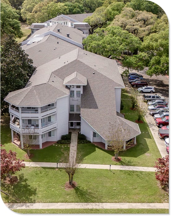 Aerial View of Wooded Campus and Multi-Wing Building at Independent Living Facility Aerial View of Wooded Campus and Multi-Wing Building at Independent Living Facility